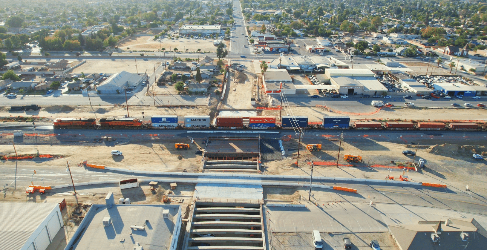 BNSF train in operation over the CA High-Speed Rail Poso Avenue Underpass