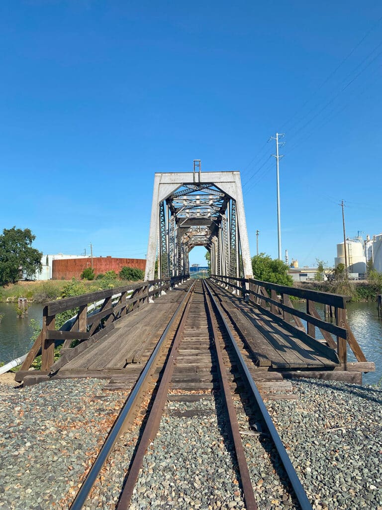 railroad tracks leading to a bridge