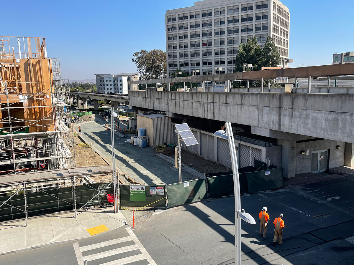 construction of BART's modernization is shown with works in hardhats