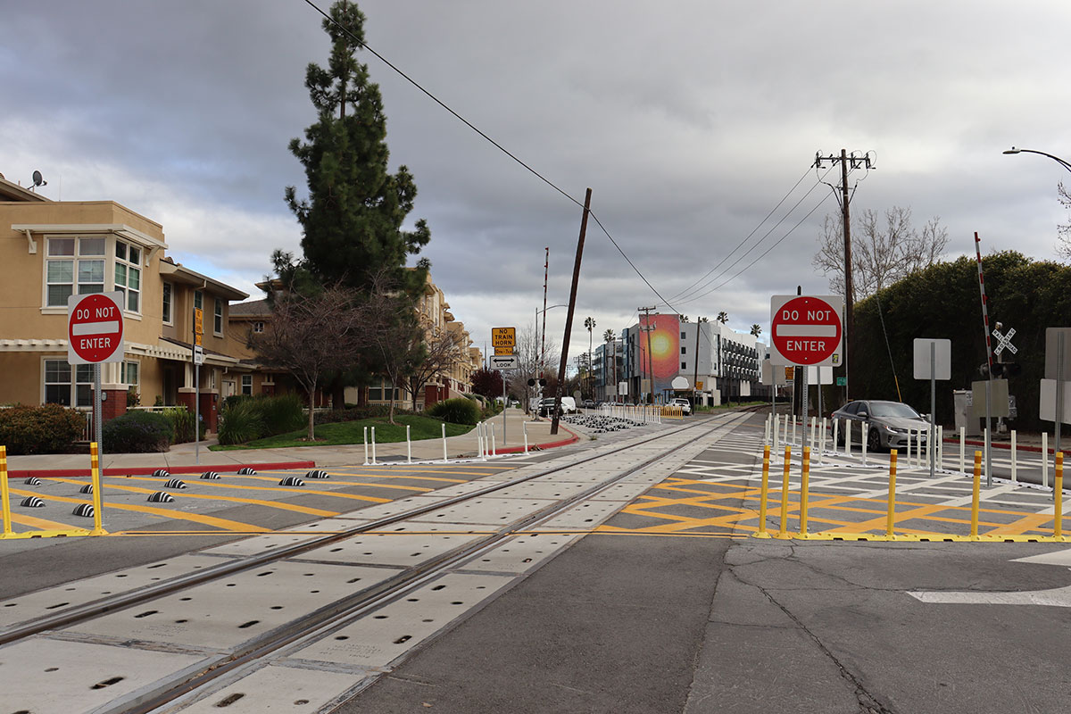 at-grade crossing showing rail tracks and street in San Jose, CA