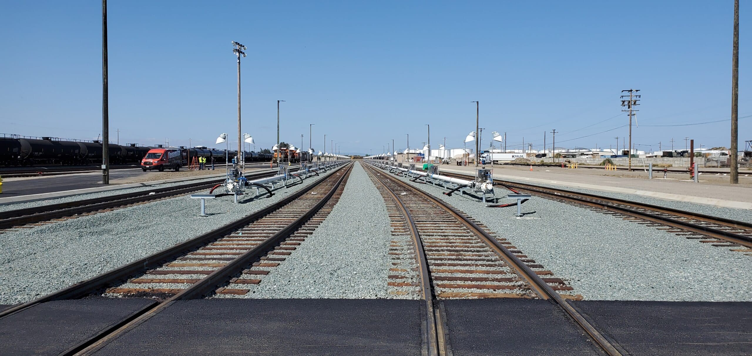 4 railroad tracks run into the distance