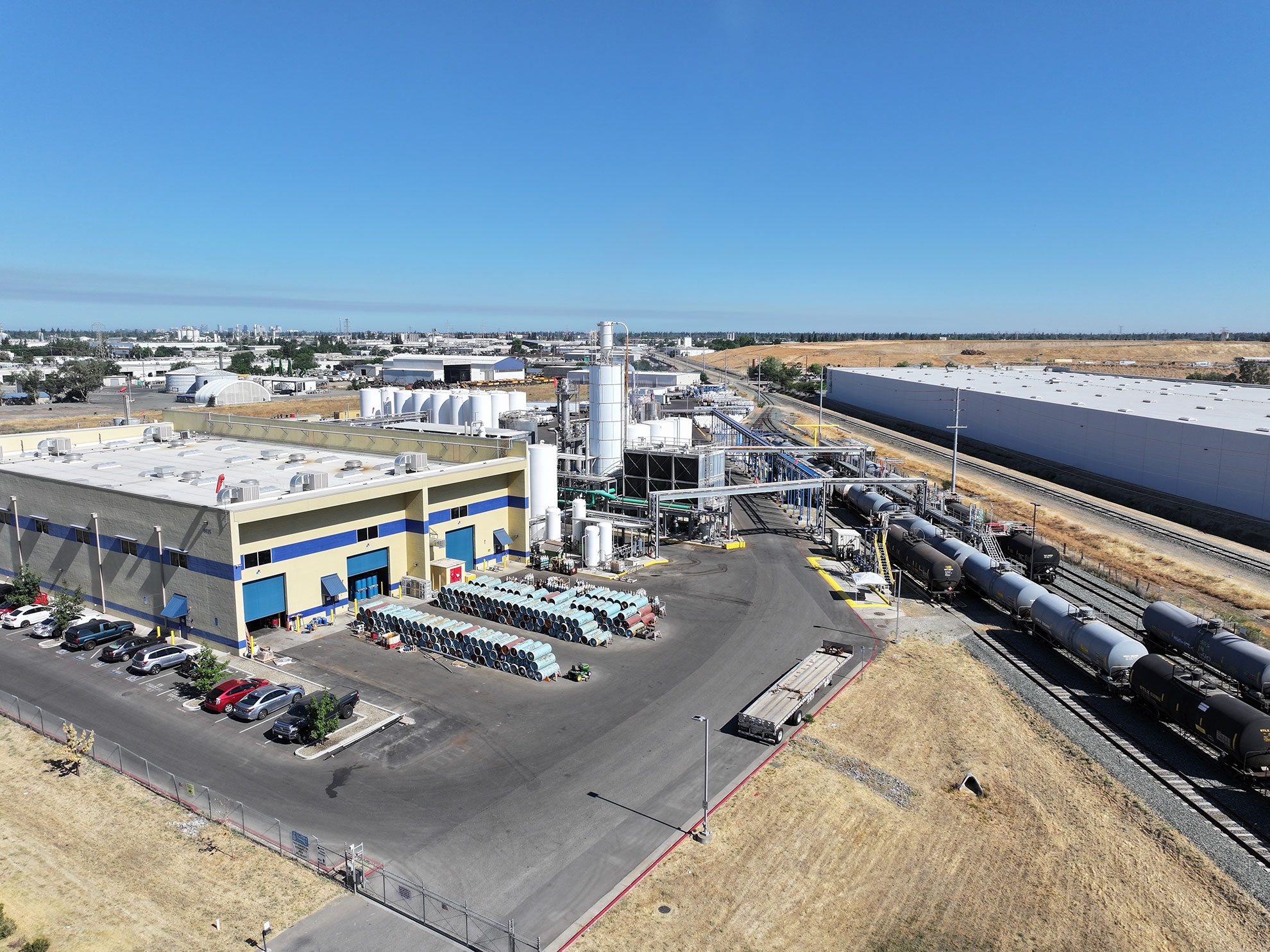 aerial view of an industrial site with Railroad industry lead with oil tankers